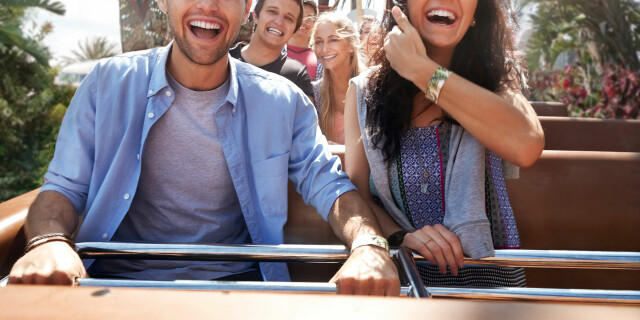 Smiling couple on roller coaster